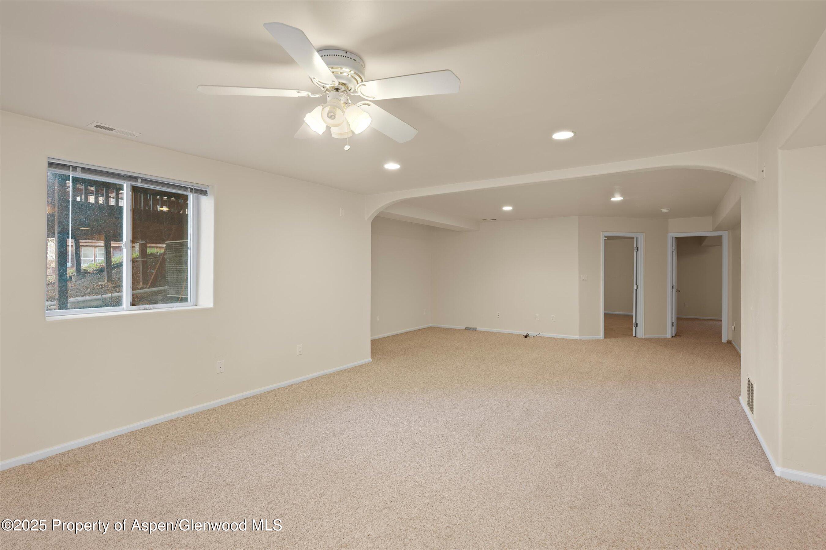 634 East First Street New Castle, CO 81647 - Photo 12 of 46 a view of an empty room with a window