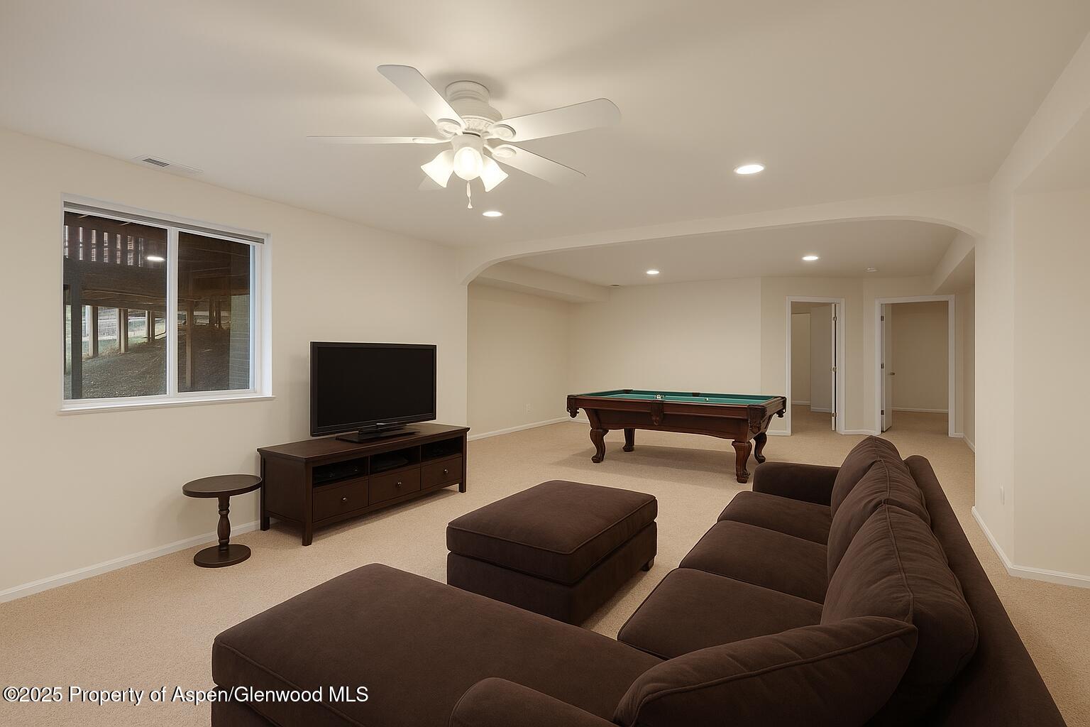634 East First Street New Castle, CO 81647 - Photo 13 of 46 a living room with furniture and a flat screen tv
