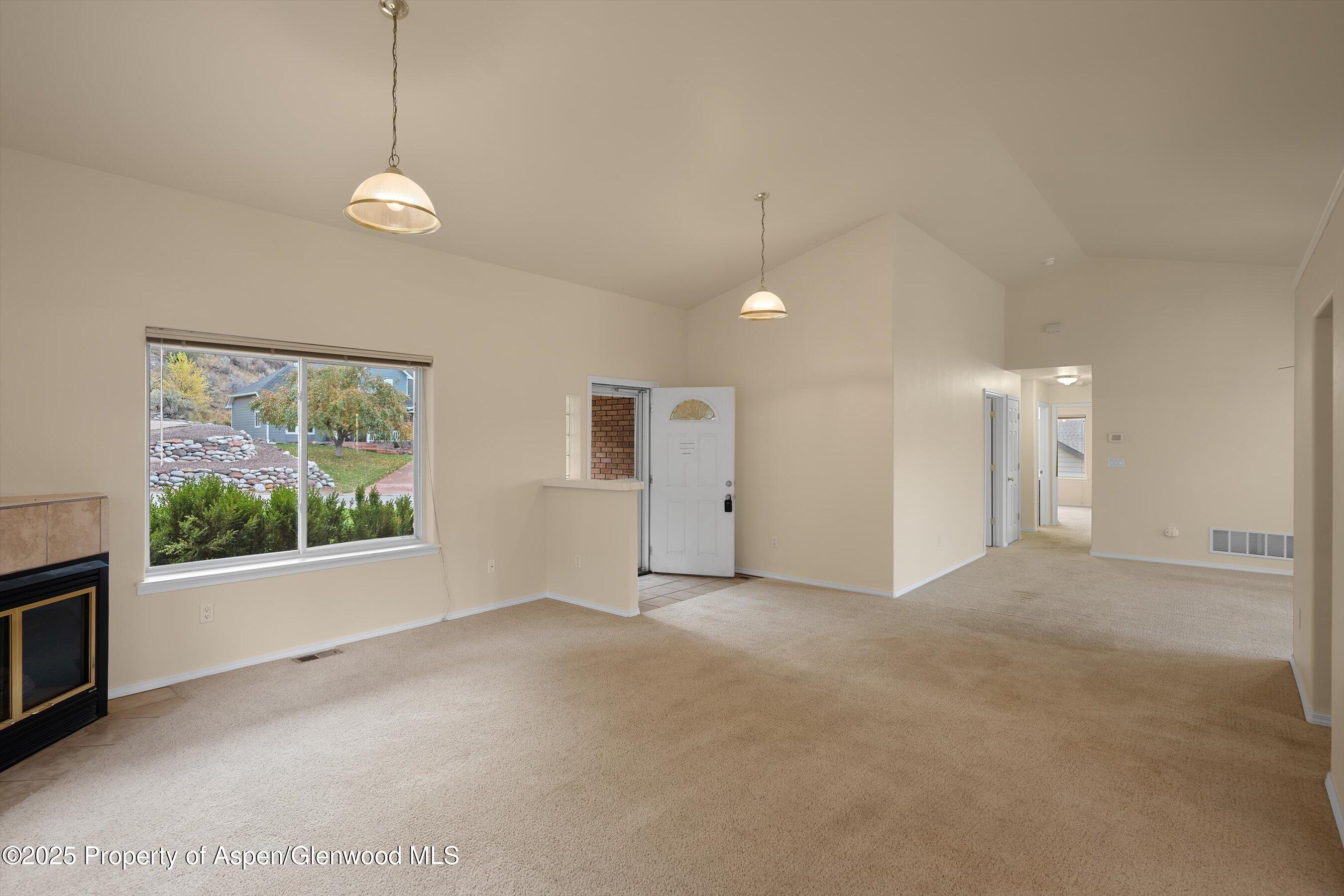634 East First Street New Castle, CO 81647 - Photo 22 of 46 a view of an empty room with a window
