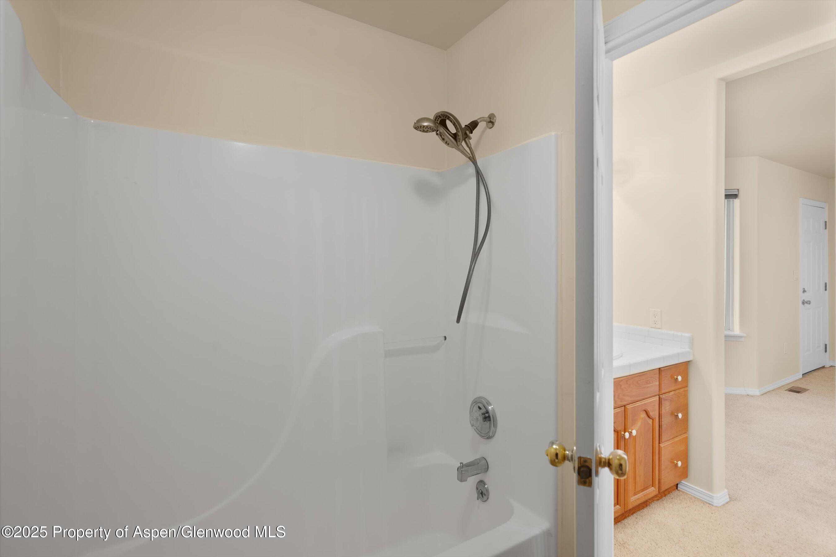 634 East First Street New Castle, CO 81647 - Photo 25 of 46 a bathroom with a bathtub