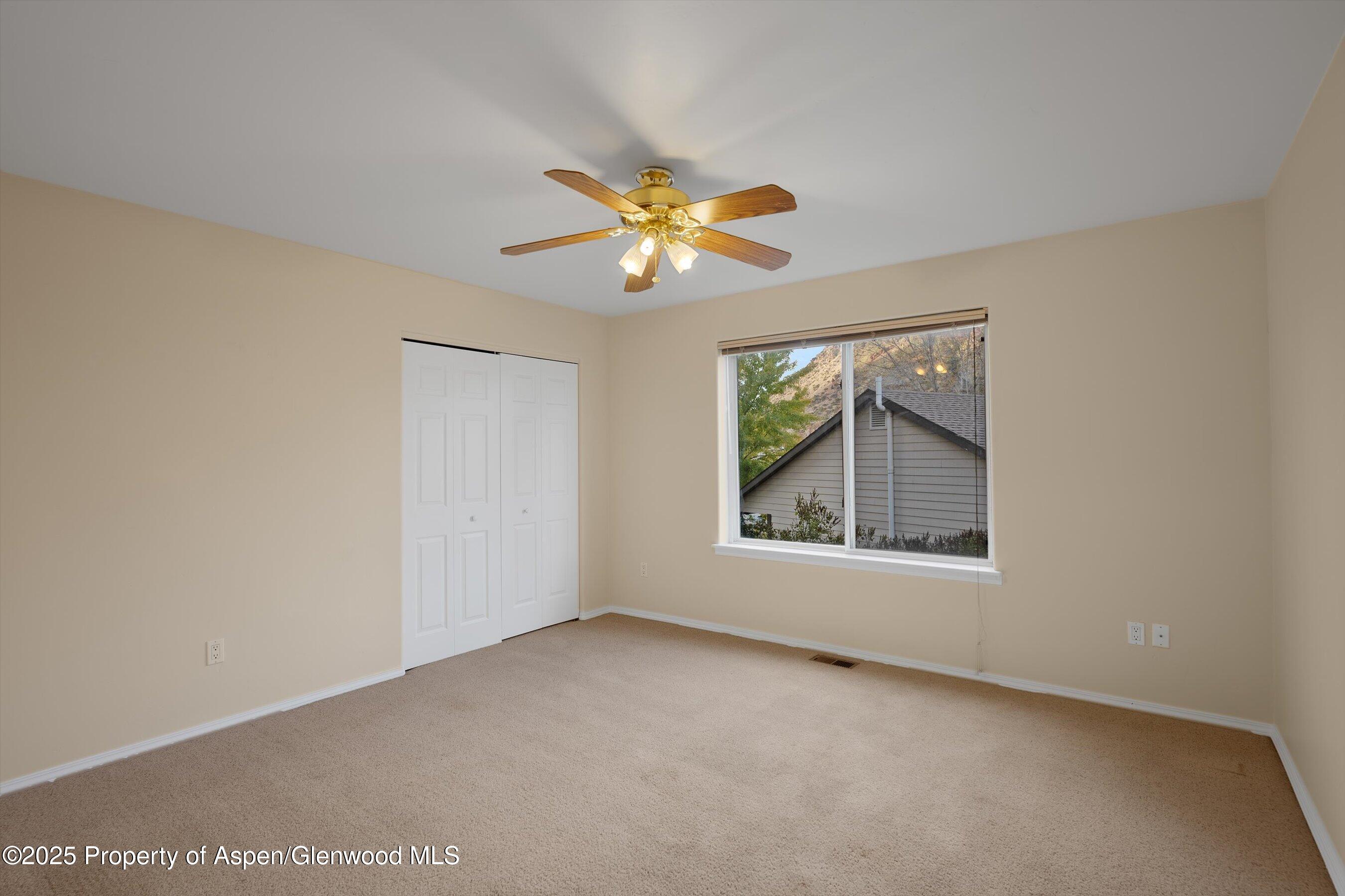 634 East First Street New Castle, CO 81647 - Photo 27 of 46 a view of an empty room with a window