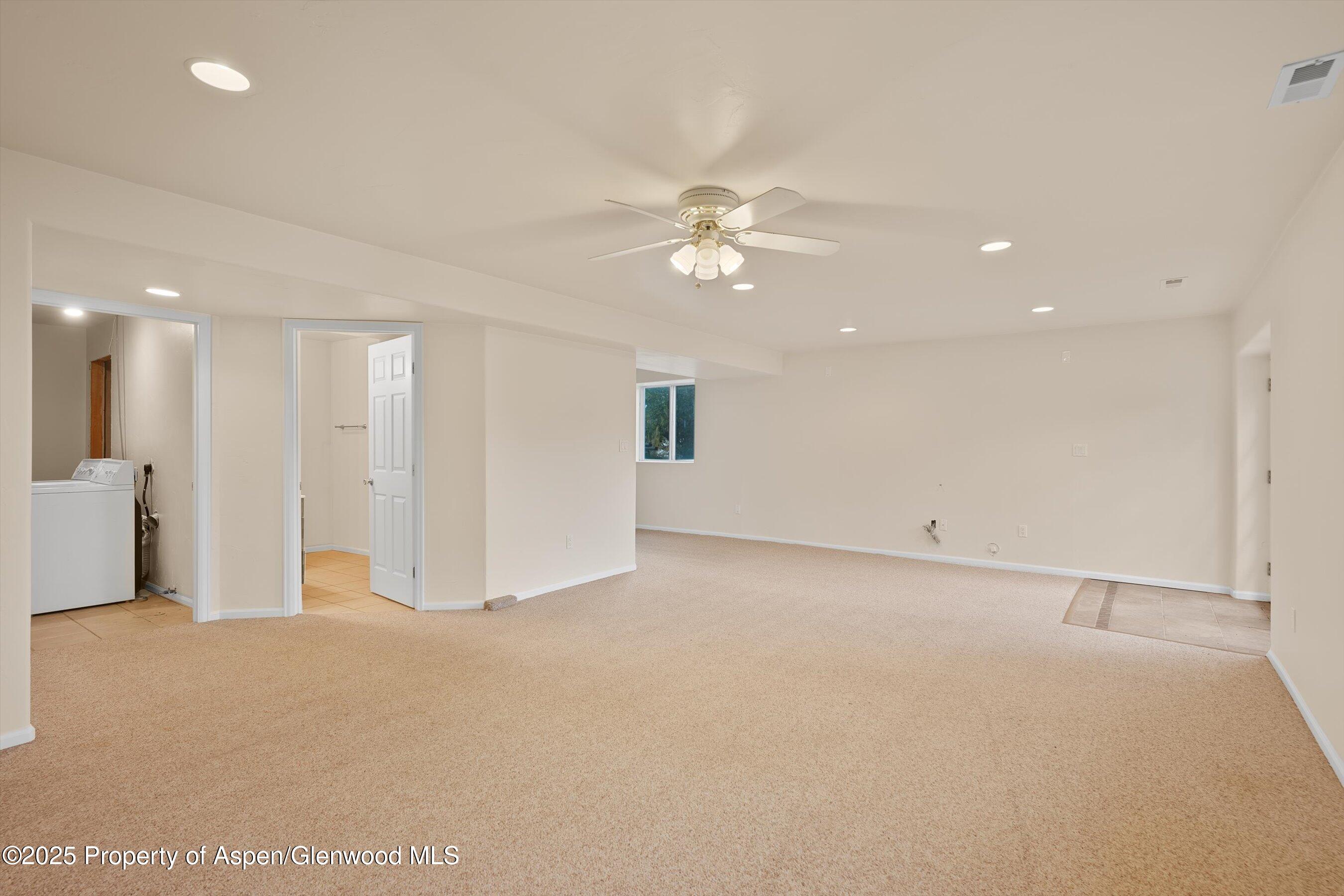 634 East First Street New Castle, CO 81647 - Photo 32 of 46 a view of an empty room with a ceiling fan