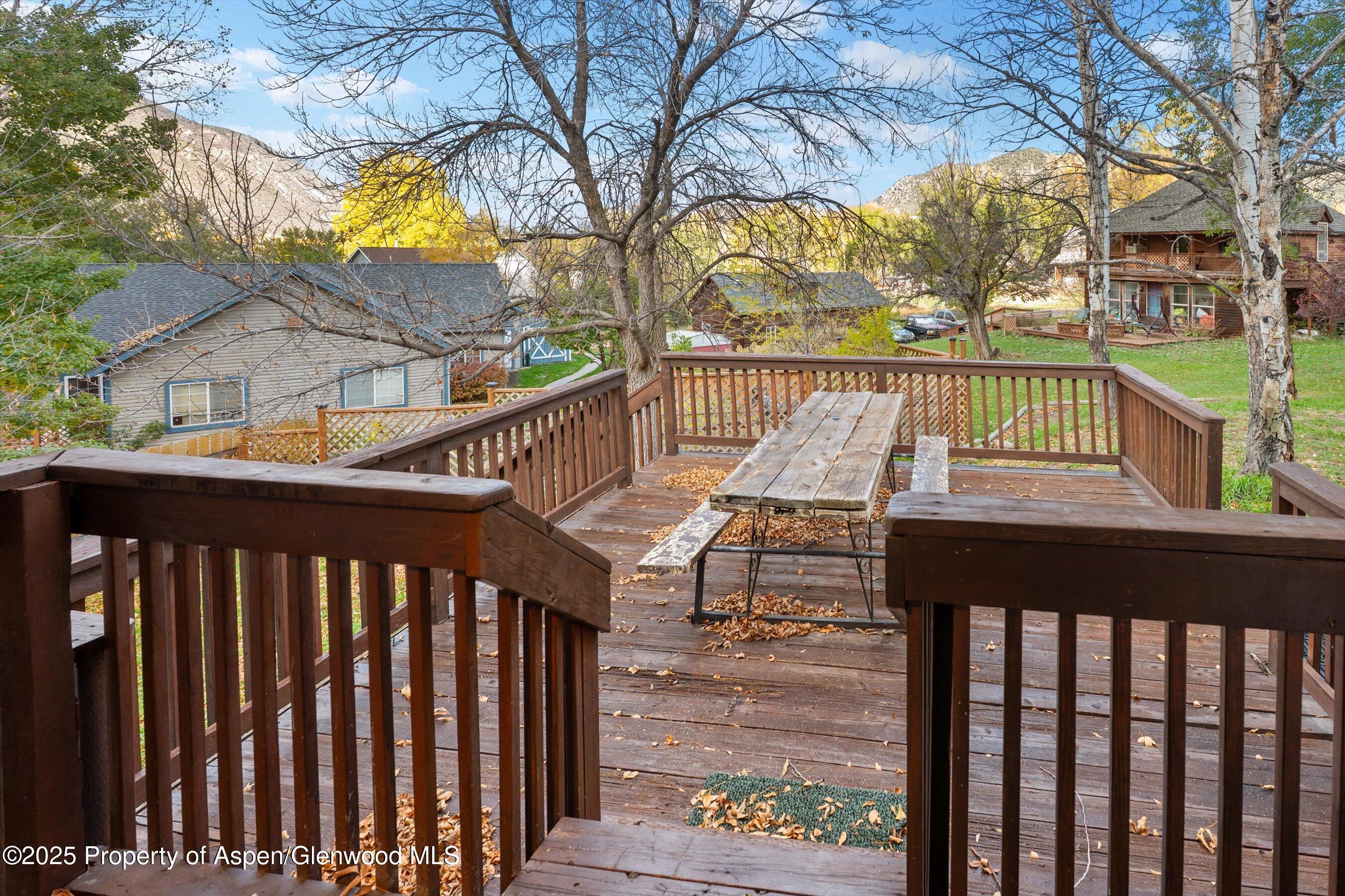 634 East First Street New Castle, CO 81647 - Photo 35 of 46 a view of a wooden deck with a trees