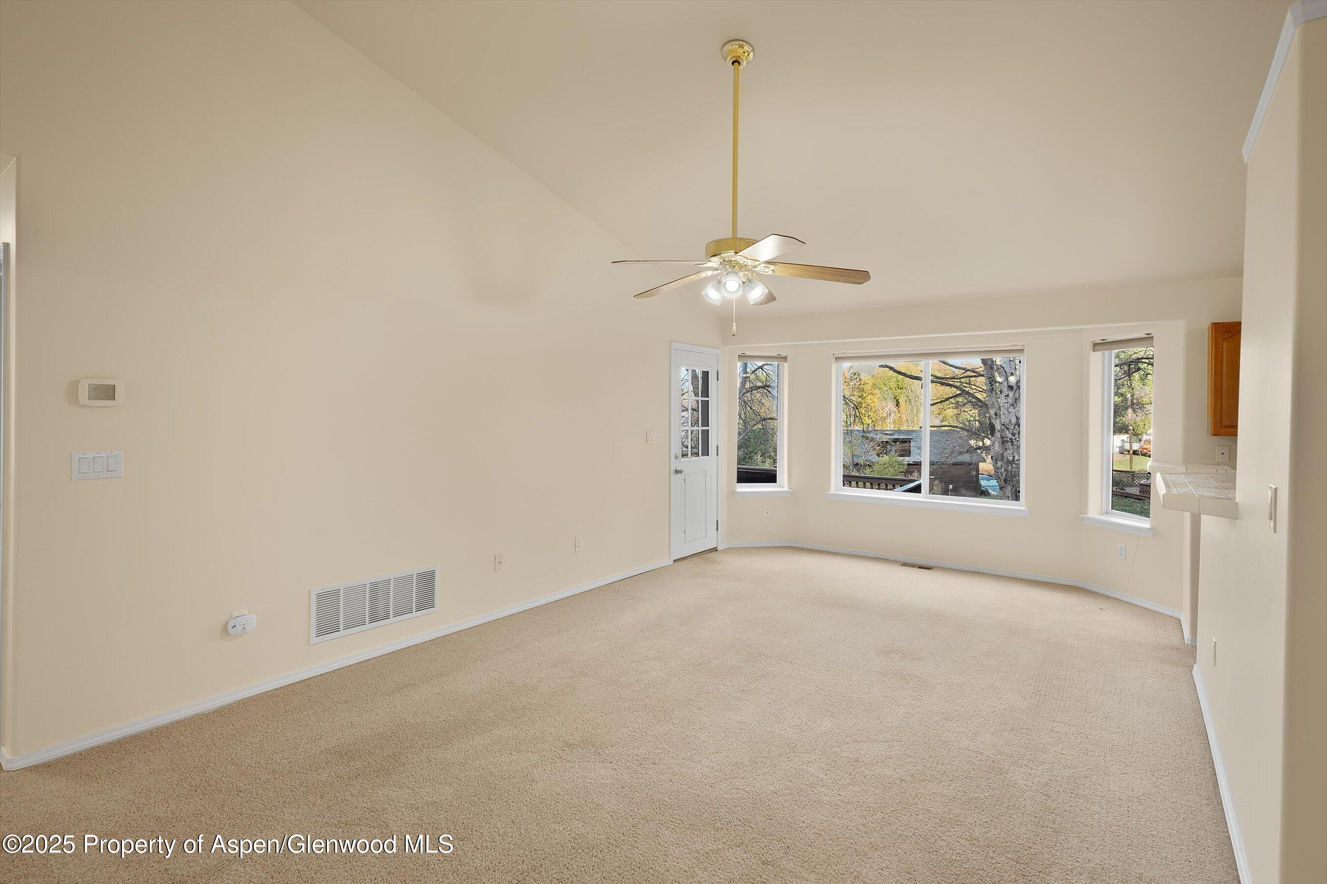 634 East First Street New Castle, CO 81647 - Photo 4 of 46 a view of an empty room with window