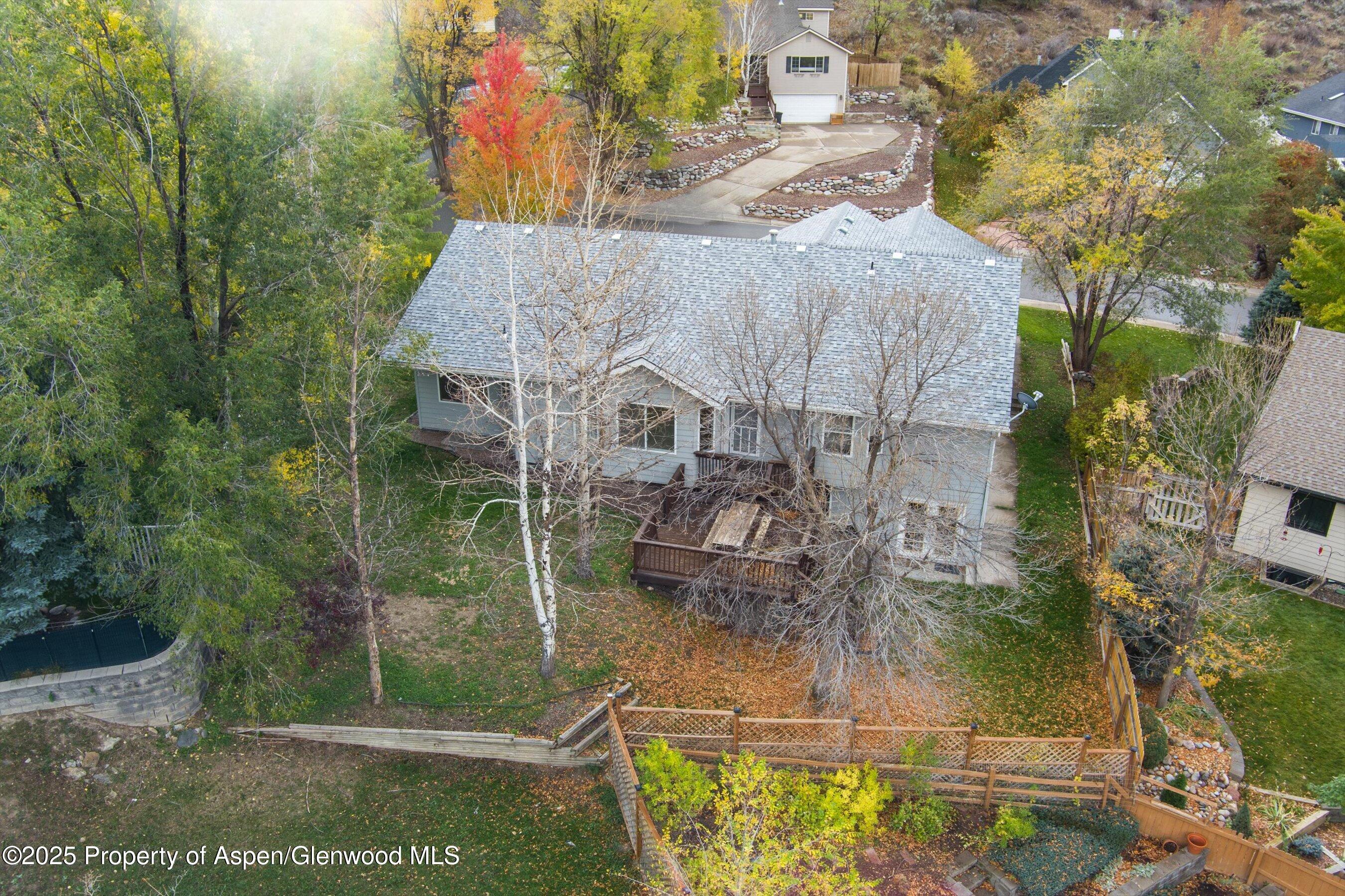 634 East First Street New Castle, CO 81647 - Photo 42 of 46 a aerial view of a house with a yard