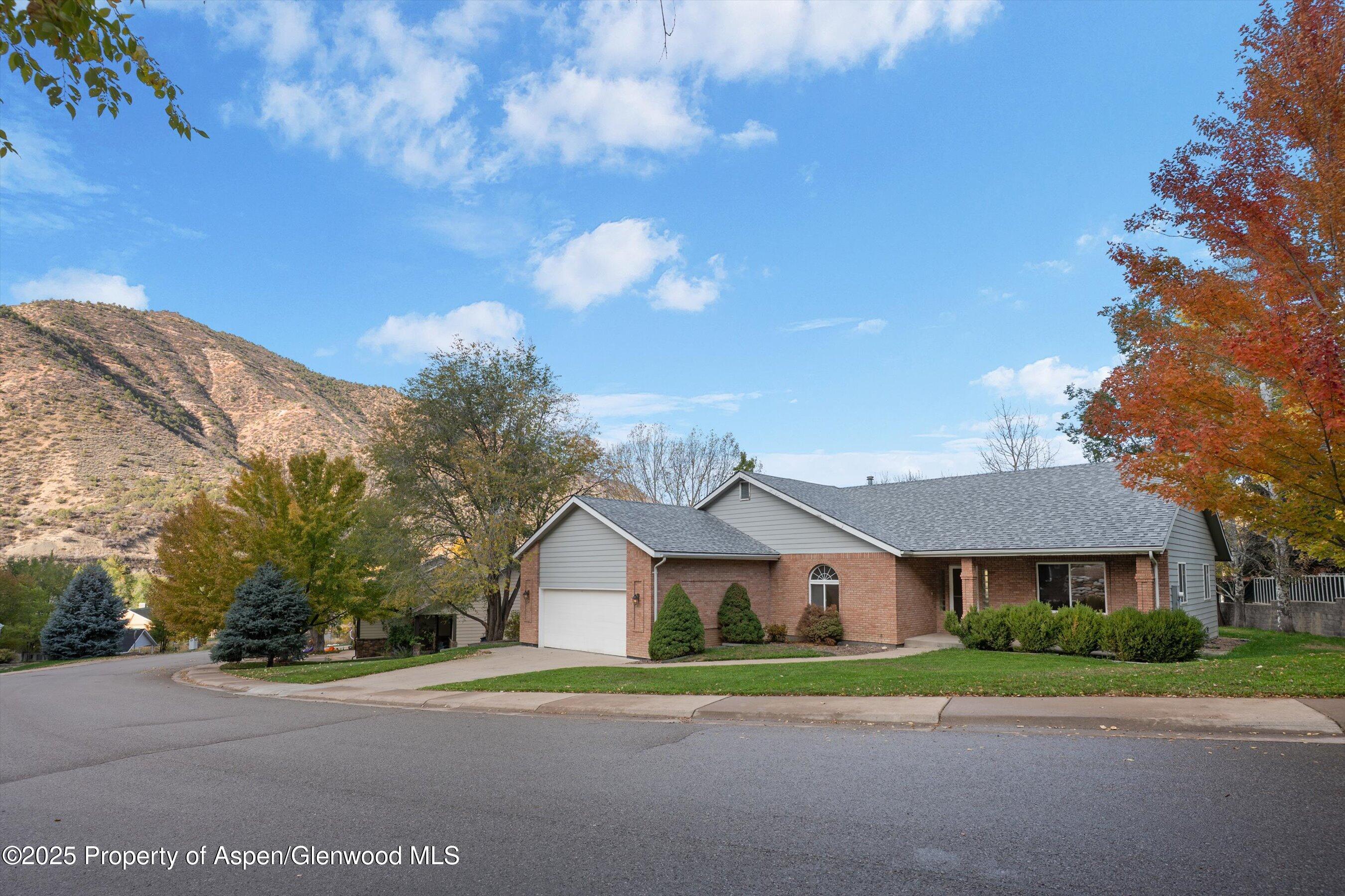 634 East First Street New Castle, CO 81647 - Photo 44 of 46 a view of a big house with a big yard and large trees