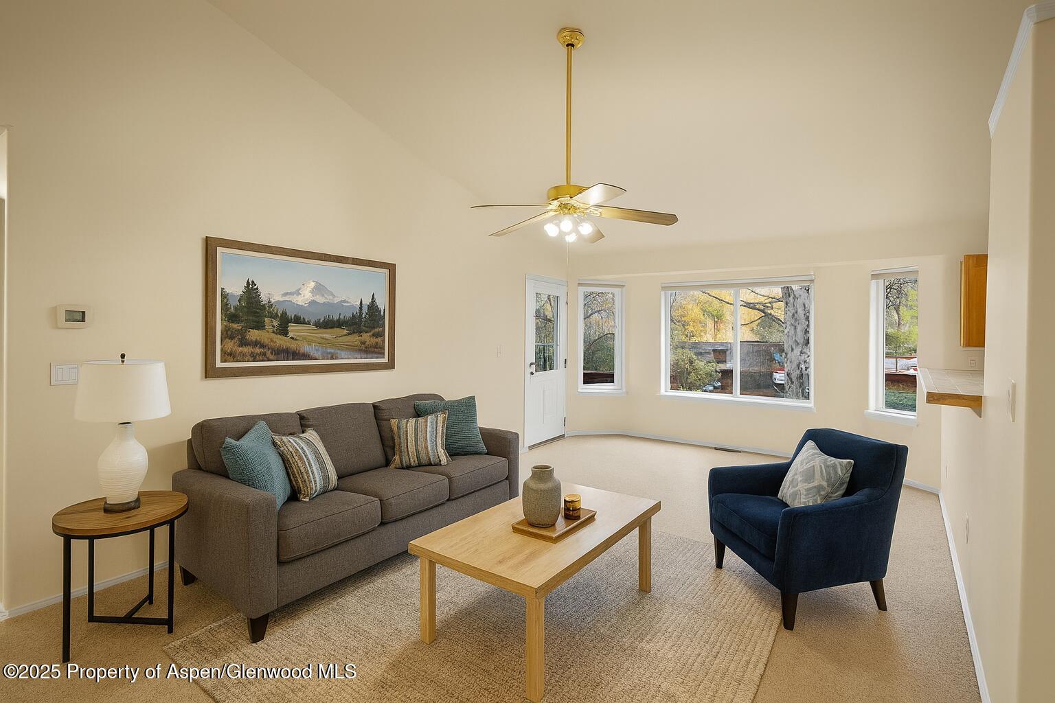 634 East First Street New Castle, CO 81647 - Photo 5 of 46 a living room with furniture and a chandelier