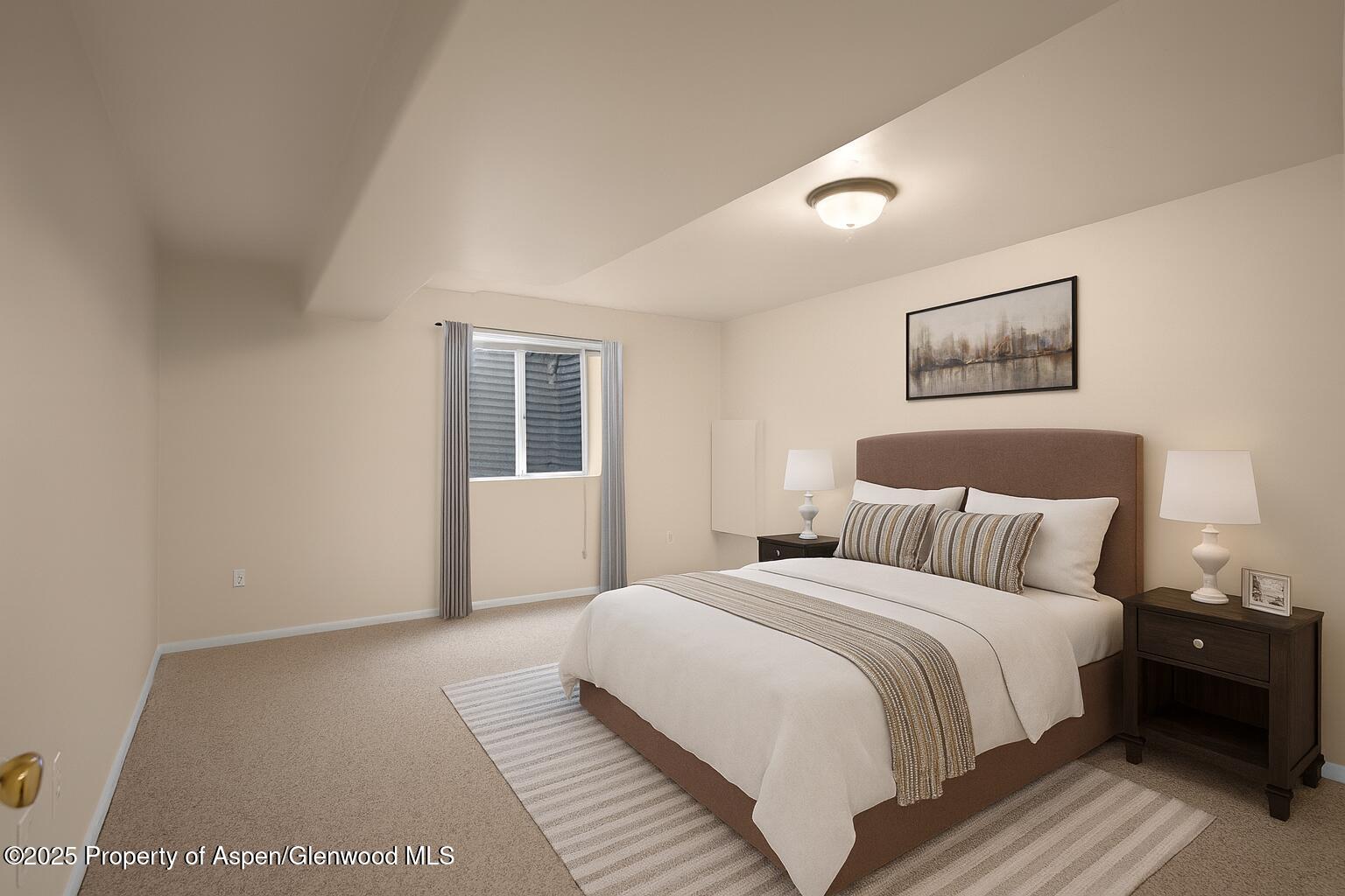 634 East First Street New Castle, CO 81647 - Photo 9 of 46 a bedroom with a large bed and a window