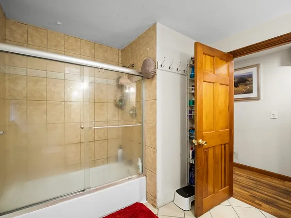 a bathroom with a shower and a bathtub