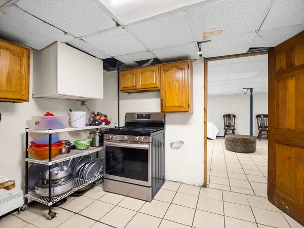 a kitchen with stainless steel appliances granite countertop a sink and a refrigerator