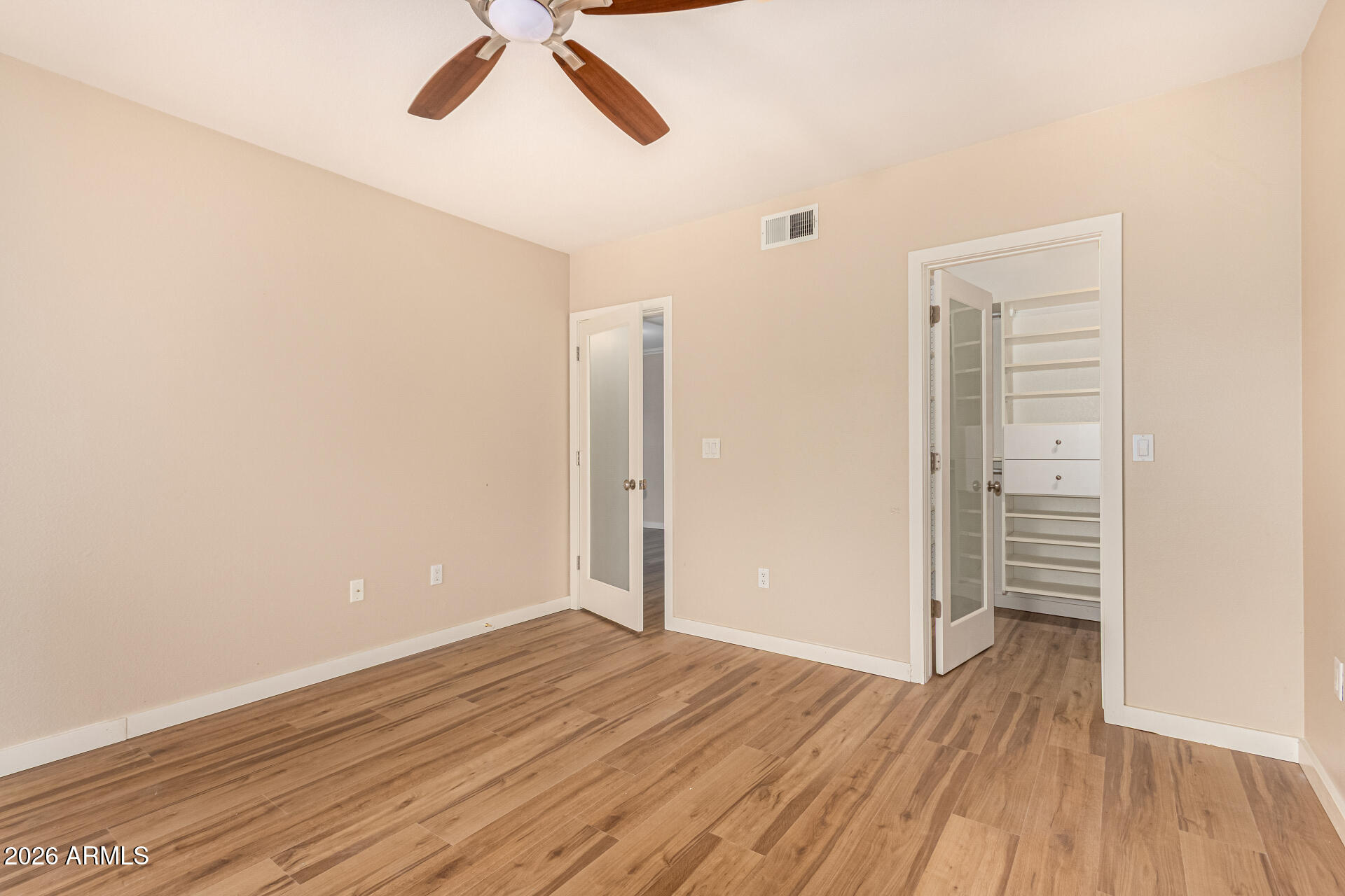 7575 East Indian Bend Road, Unit 2036 Scottsdale, AZ 85250 - Photo 13 of 29 a view of empty room with wooden floor