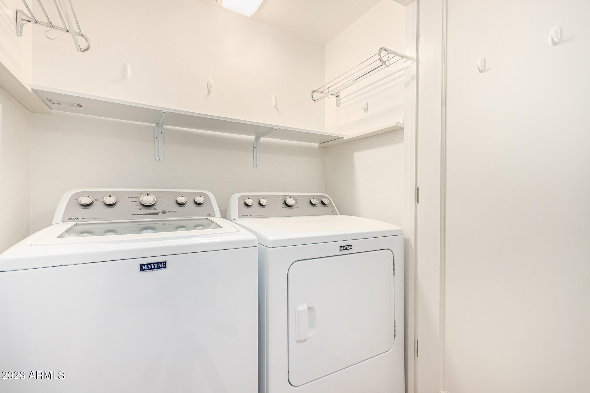 7575 East Indian Bend Road, Unit 2036 Scottsdale, AZ 85250 - Photo 17 of 29 a utility room with dryer and washer