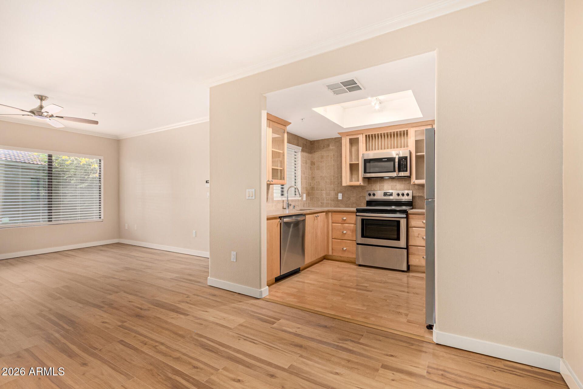 7575 East Indian Bend Road, Unit 2036 Scottsdale, AZ 85250 - Photo 8 of 29 a kitchen with stainless steel appliances a refrigerator and a stove top oven
