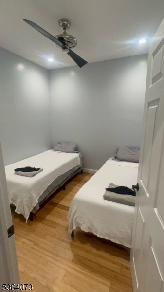 753 South 11th Street Newark, NJ 07103 - Photo 10 of 10 a bedroom with two beds and a ceiling fan