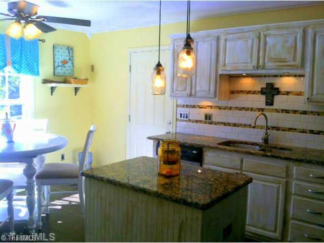 208 Stapleton Way High Point, NC 27265 - Photo 4 of 15 Kitchen. Granite counter tops and added tile back splash with under counter lighting