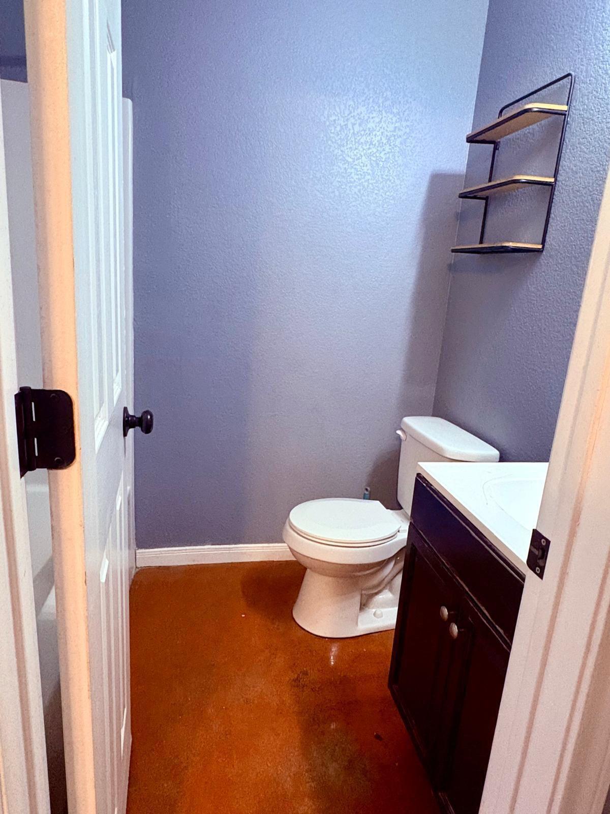 1403 Strickland Street Waco, TX 76705 - Photo 11 of 11 a bathroom with a toilet and a sink