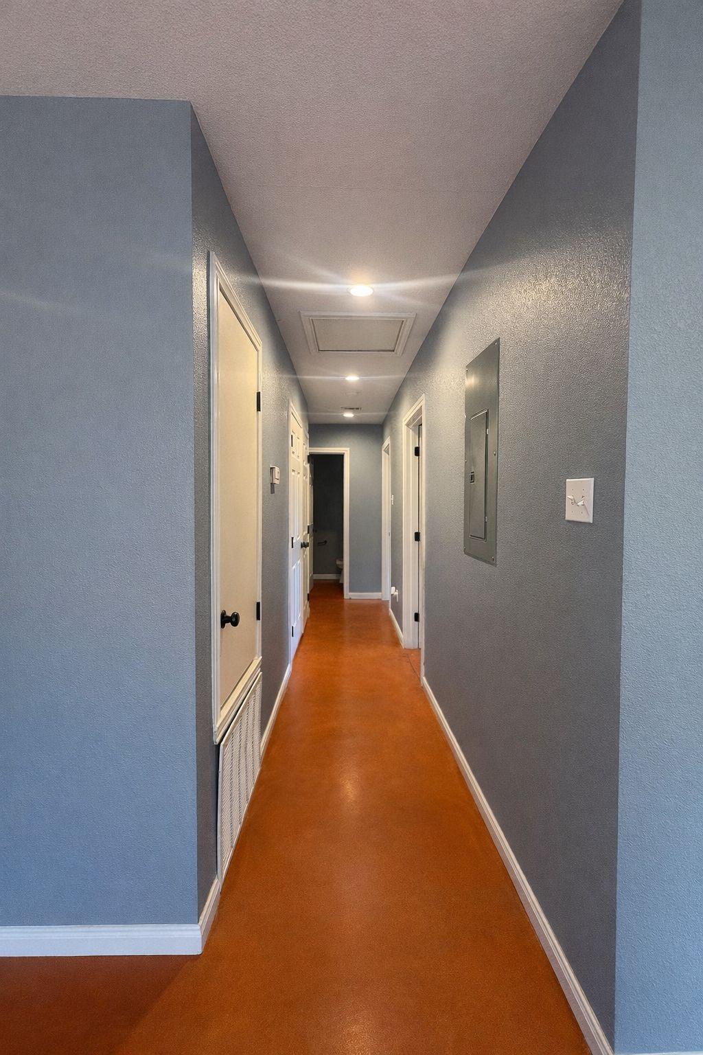 1403 Strickland Street Waco, TX 76705 - Photo 5 of 11 a view of a hallway with wooden floor