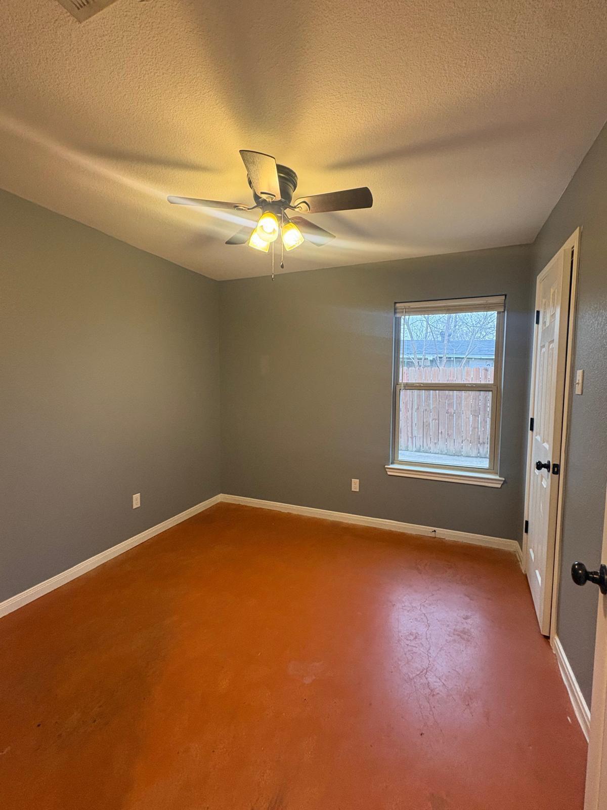 1403 Strickland Street Waco, TX 76705 - Photo 8 of 11 a view of an empty room with a window