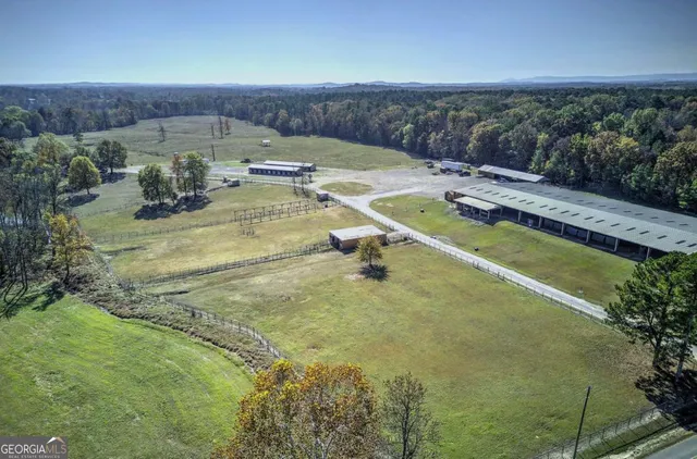 a view of a swimming pool with a yard