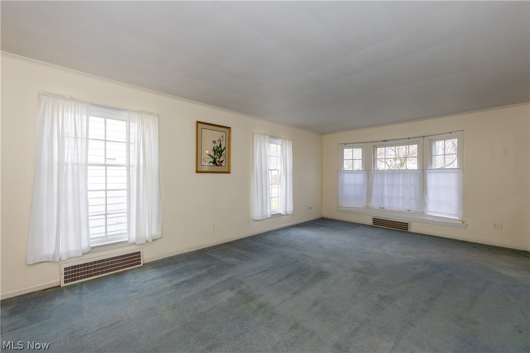 1050 Renfield Road Cleveland Heights, OH 44121 - Photo 9 of 41 Living room with carpet and ornamental molding