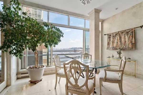 a view of a dining room with furniture window and outside view