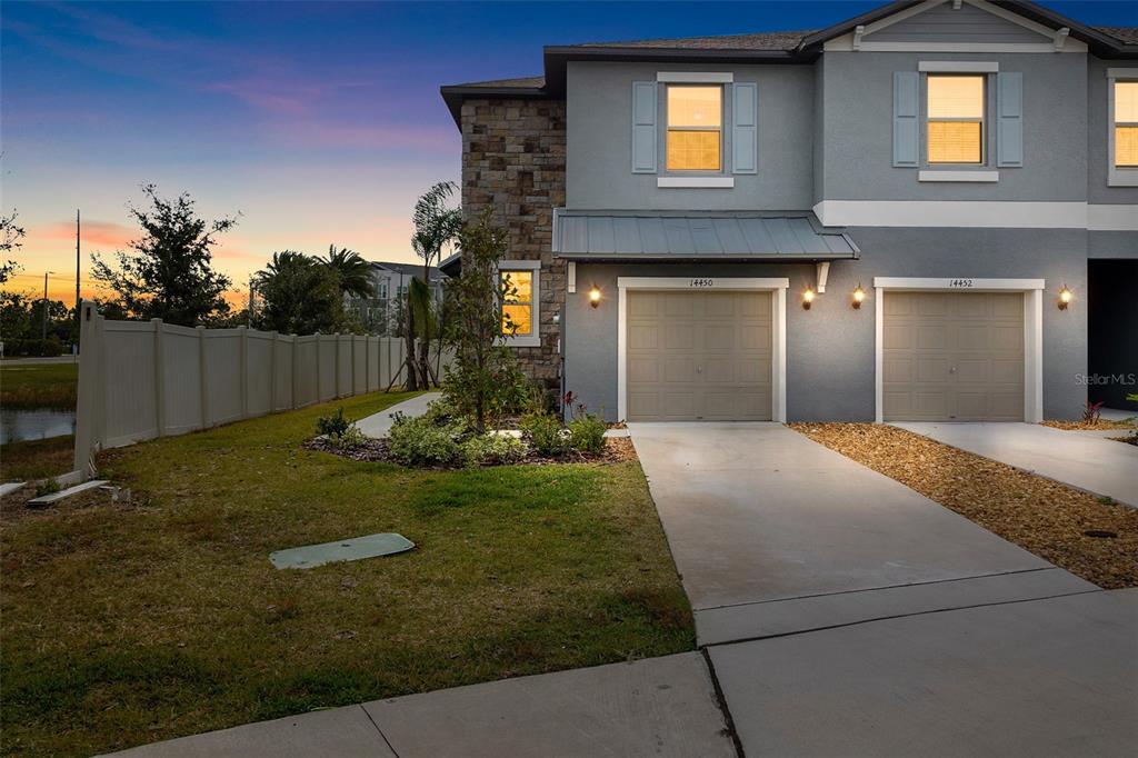 14450 Easy Goer Street Ruskin, FL 33573 - Photo 1 of 27 a front view of a house with garden