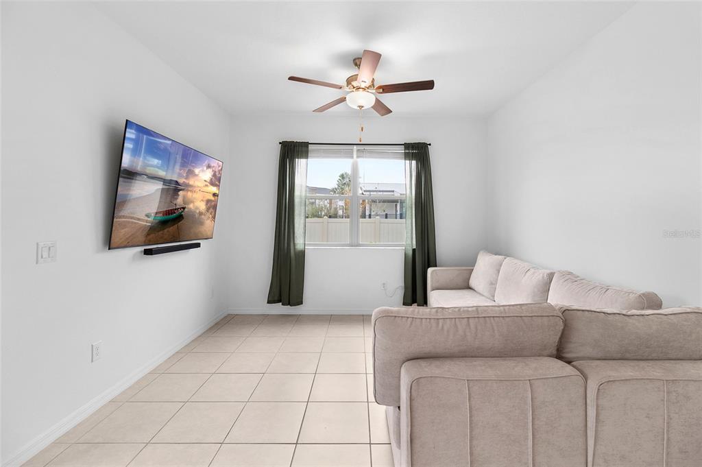 14450 Easy Goer Street Ruskin, FL 33573 - Photo 11 of 27 a living room with furniture and a window