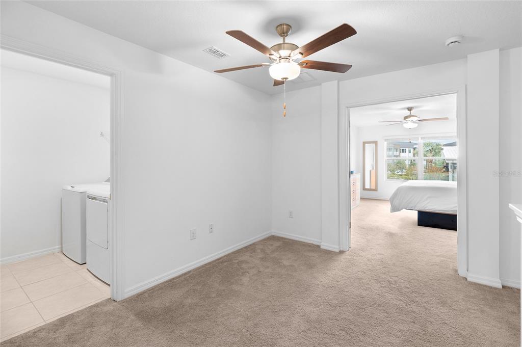 14450 Easy Goer Street Ruskin, FL 33573 - Photo 15 of 27 wooden floor in an empty room and a window