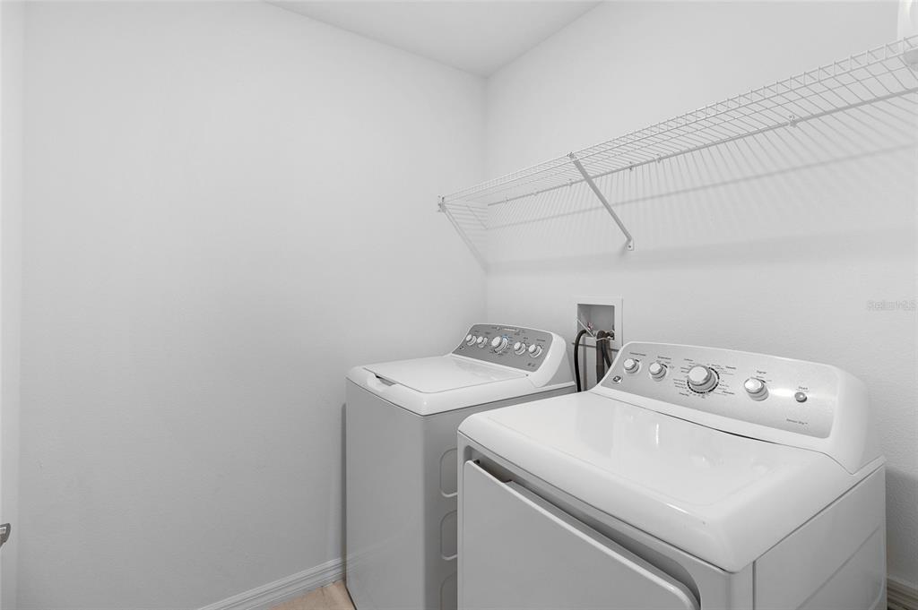 14450 Easy Goer Street Ruskin, FL 33573 - Photo 23 of 27 a utility room with dryer and washer