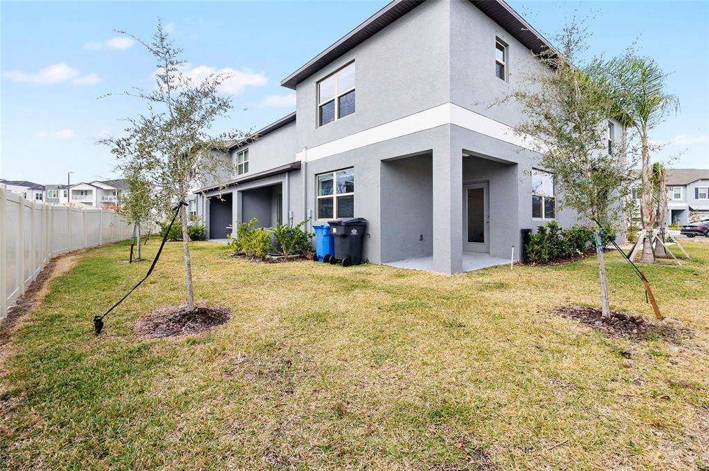 14450 Easy Goer Street Ruskin, FL 33573 - Photo 26 of 27 a view of a house with a yard