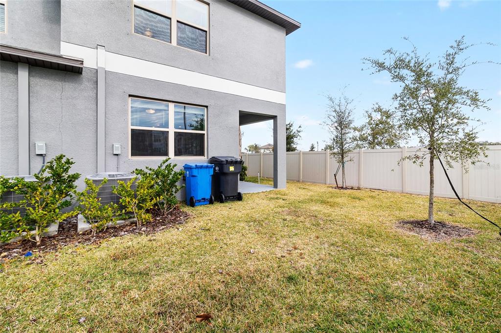 14450 Easy Goer Street Ruskin, FL 33573 - Photo 27 of 27 a backyard of a house with table and chairs