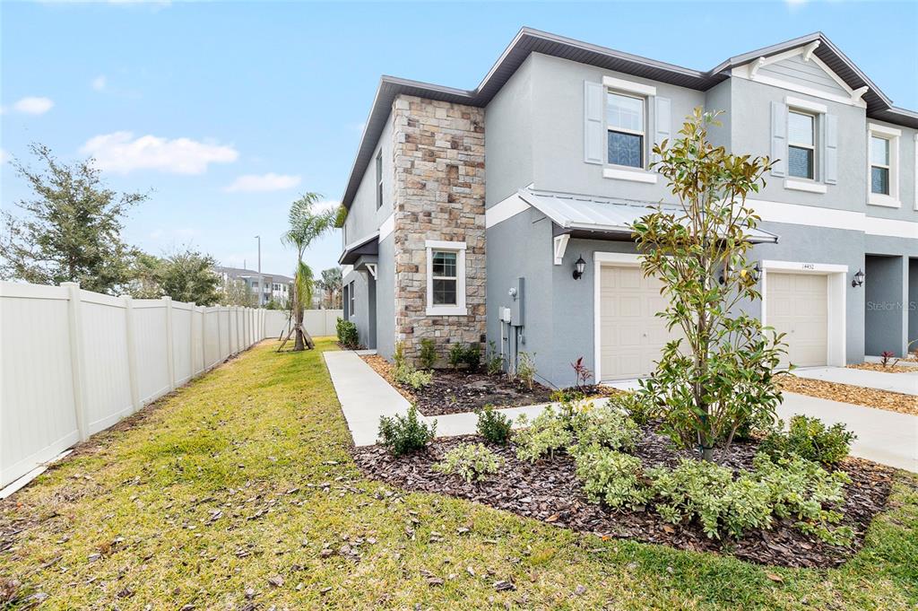 14450 Easy Goer Street Ruskin, FL 33573 - Photo 3 of 27 front view of a house with a yard