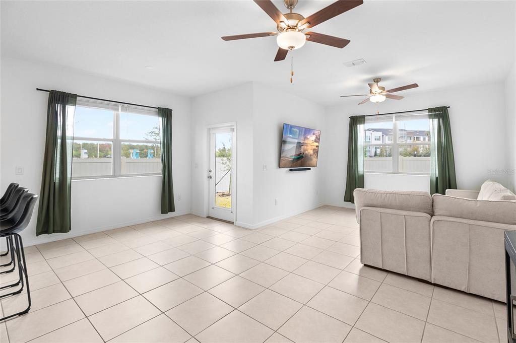 14450 Easy Goer Street Ruskin, FL 33573 - Photo 10 of 27 a living room with furniture and a window