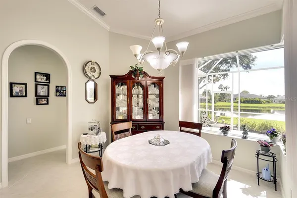 a view of a dining room with furniture window and outside view