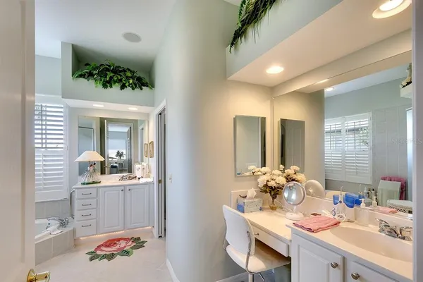 a bathroom with a double vanity sink and a mirror
