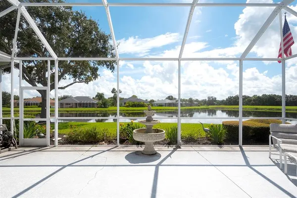 a view of a patio with a yard