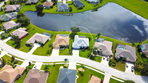 an aerial view of a house with a swimming pool