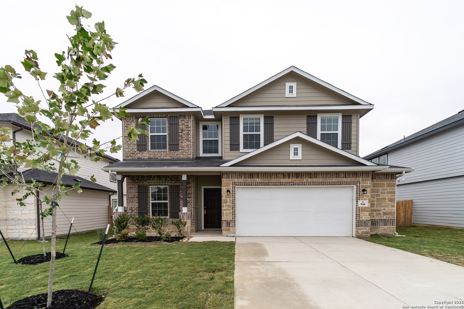 944 Tornado Ridge New Braunfels, TX 78130 - Photo 1 of 1 a front view of a house with a yard and garage