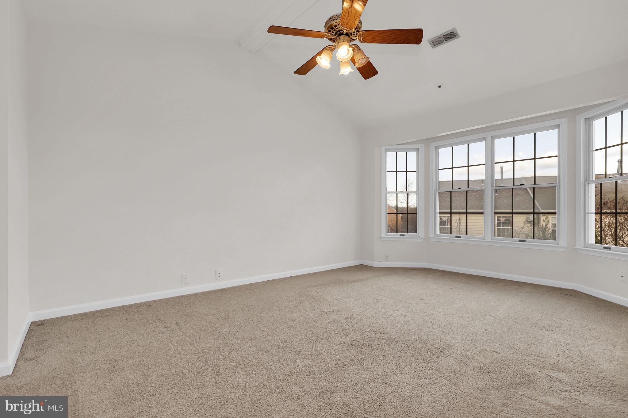 3920 Dunes Way Burtonsville, MD 20866 - Photo 20 of 33 wooden floor in an empty room with a window