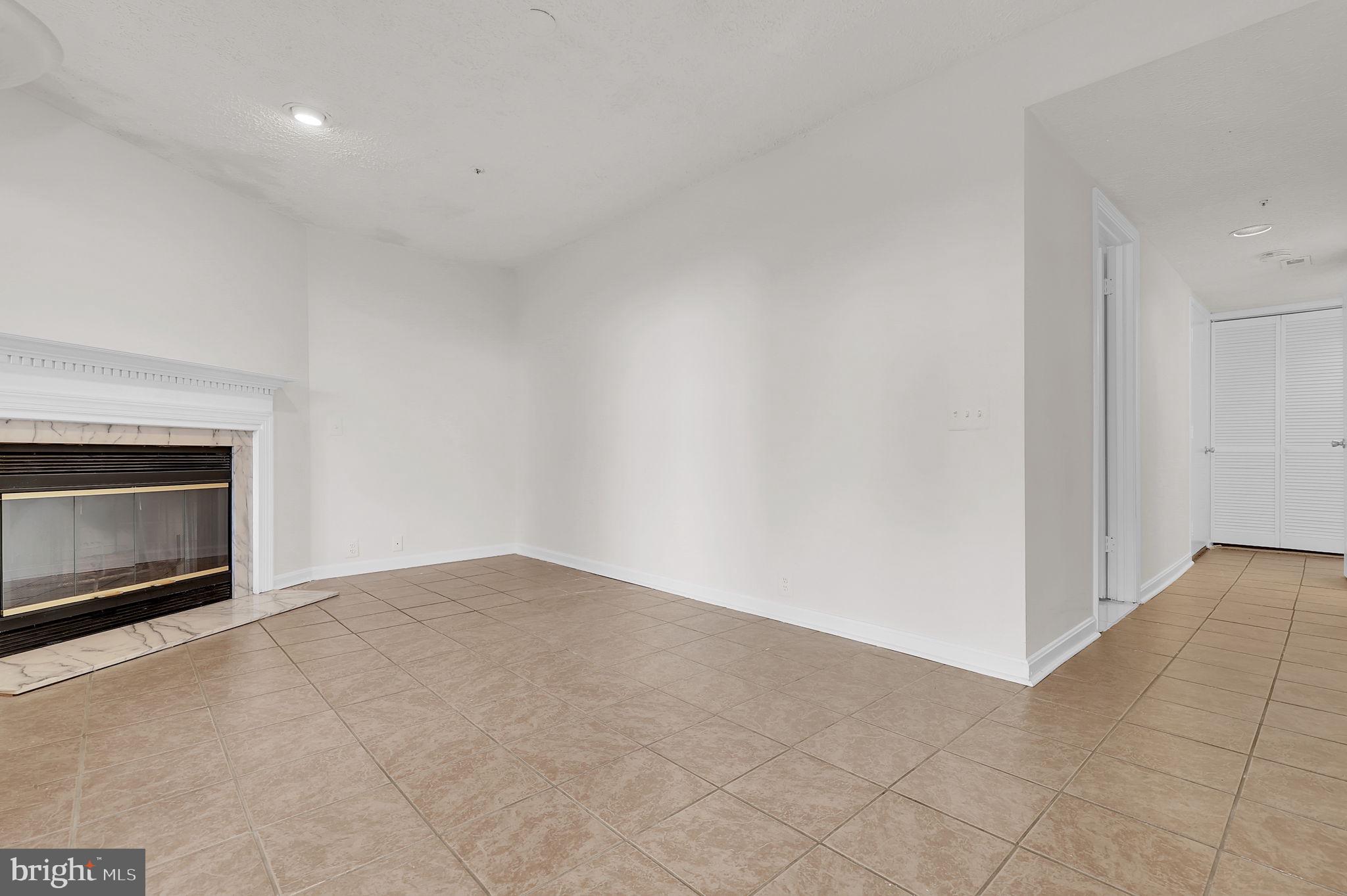 3920 Dunes Way Burtonsville, MD 20866 - Photo 29 of 33 a view of an empty room with a fireplace