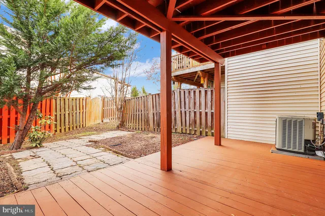 a view of a house with a large tree