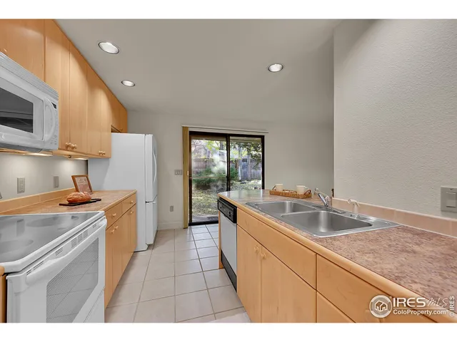 a kitchen that has a sink and a stove