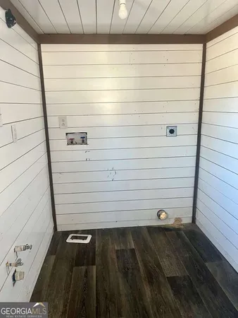 a view of a small space with wooden floor
