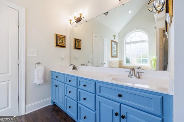 a bathroom with bathtub and window