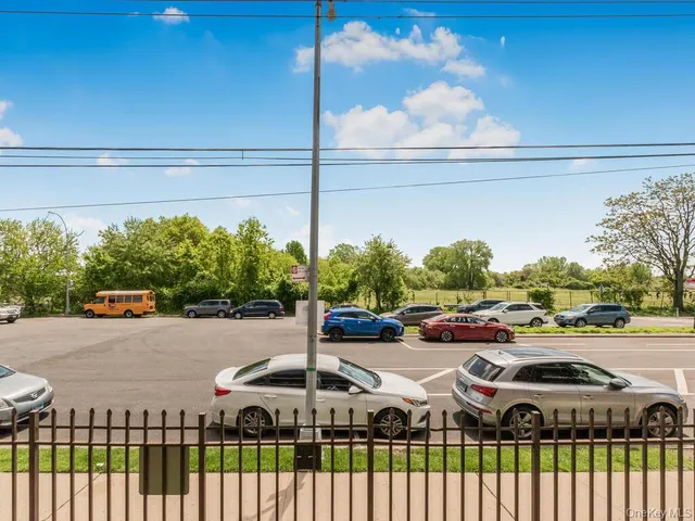 a view of a patio with chairs and table