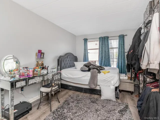 a bed room with furniture and a window