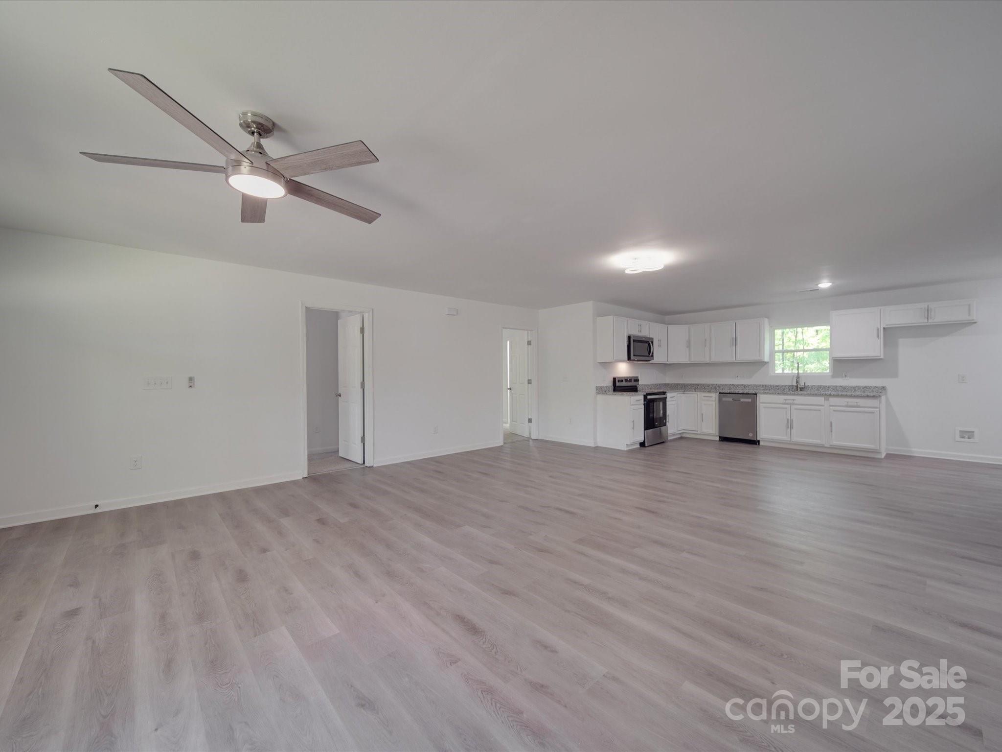 1241 Pitts Road Chester, SC 29706 - Photo 7 of 41 a view of empty room with wooden floor and windows