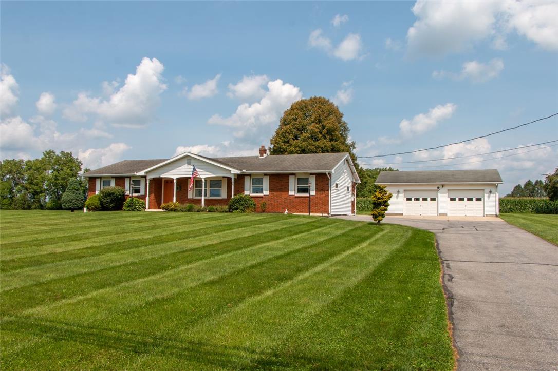 700 Newlins Road East Easton, PA 18040 - Photo 42 of 42 A well-maintained lawn perfectly complements the charming brick and white-sided ranch home and detached garage.