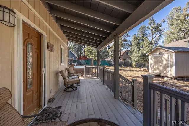 a view of living room and deck kitchen