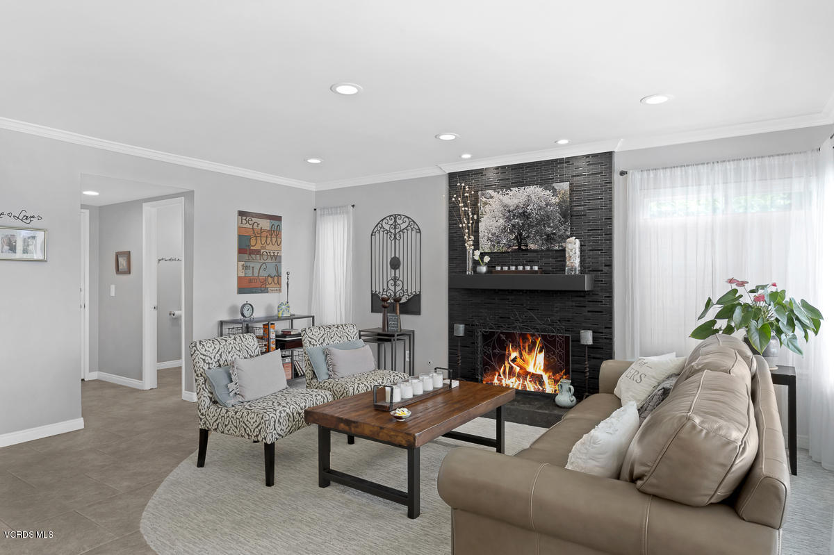 5438 Cochise Street Simi Valley, CA 93063 - Photo 19 of 35 a living room with furniture fireplace and potted plants